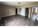 Open living room with modern flooring and multiple entryways at 11106 Wismar Dr, Indianapolis, IN 46235
