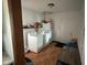 Laundry room with appliances, storage, and a convenient exterior door at 1150 Younce St, Franklin, IN 46131