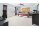 Serene bedroom featuring a large window, ceiling fan, and stylish decor at 11840 Geyser Ct, Fishers, IN 46038