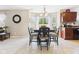 Bright dining area with a wooden table, comfortable chairs, and natural light at 11840 Geyser Ct, Fishers, IN 46038