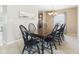 Elegant dining room featuring a dark wood table with seating for six at 11840 Geyser Ct, Fishers, IN 46038
