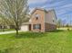 Side view of a well-maintained two-story home with lush green lawn and mature landscaping at 11840 Geyser Ct, Fishers, IN 46038