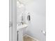 Neat powder room with a pedestal sink, a mirror, and modern fixtures at 11840 Geyser Ct, Fishers, IN 46038