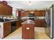 Functional kitchen equipped with stainless steel appliances, ample cabinetry, and a central island at 11840 Geyser Ct, Fishers, IN 46038