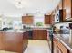 Well-lit kitchen featuring ample counter space, stainless steel appliances, and modern fixtures at 11840 Geyser Ct, Fishers, IN 46038