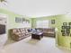 Spacious living room with a large sectional sofa and ample natural light at 11840 Geyser Ct, Fishers, IN 46038