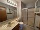 Functional bathroom with a shower, vanity, and mirror, offering essential amenities at 1215 Willow Springs Blvd, Brownsburg, IN 46112