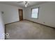 Simple bedroom with neutral carpet, a standard window, and basic interior features at 1215 Willow Springs Blvd, Brownsburg, IN 46112