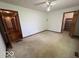 Bedroom featuring neutral carpeting and two standard closets on either side of the room at 1215 Willow Springs Blvd, Brownsburg, IN 46112
