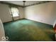 Bright bedroom features ceiling fan and trim, awaiting your personal touch at 1215 Willow Springs Blvd, Brownsburg, IN 46112