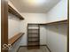 Walk-in closet featuring carpet, shelving, and hanging rods for optimal storage at 1215 Willow Springs Blvd, Brownsburg, IN 46112