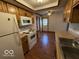 Eat-in kitchen features white appliances and wood cabinets with laminate countertops at 1215 Willow Springs Blvd, Brownsburg, IN 46112