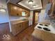 View of the kitchen featuring light wood cabinets and laminate countertops at 1215 Willow Springs Blvd, Brownsburg, IN 46112