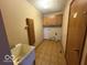 Functional laundry room features cabinets and a utility sink for added convenience at 1215 Willow Springs Blvd, Brownsburg, IN 46112