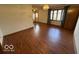 The living room has hardwood floors and a large window for natural light at 1215 Willow Springs Blvd, Brownsburg, IN 46112