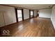 Spacious living room featuring hardwood floors, large windows, and ample natural light at 1215 Willow Springs Blvd, Brownsburg, IN 46112