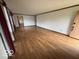Open floor plan with hardwood floors and windows providing natural light at 1215 Willow Springs Blvd, Brownsburg, IN 46112