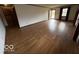 Bright living room with hardwood floors and natural light from a large window at 1215 Willow Springs Blvd, Brownsburg, IN 46112