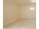 Clean basement with tile flooring, a small window, and neutral-colored walls at 12561 Gladecrest Dr, Carmel, IN 46033