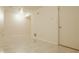 Unfinished basement featuring tile flooring, neutral walls, and access to other rooms at 12561 Gladecrest Dr, Carmel, IN 46033