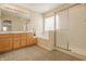 Bathroom featuring a double vanity, soaking tub and glass enclosed shower at 12561 Gladecrest Dr, Carmel, IN 46033