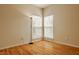 Bright bedroom with hardwood floors, neutral walls, and natural light from two large windows at 12561 Gladecrest Dr, Carmel, IN 46033