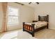 Bedroom with carpet, window with curtains, bed, and end table with lamp at 12561 Gladecrest Dr, Carmel, IN 46033