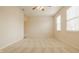 Large bedroom with neutral walls, carpet, two windows and ceiling fan at 12561 Gladecrest Dr, Carmel, IN 46033