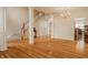 Spacious living room with hardwood floors, chandelier, and staircase at 12561 Gladecrest Dr, Carmel, IN 46033