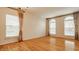 Living room with hardwood floors, lots of natural light with large windows, and blinds at 12561 Gladecrest Dr, Carmel, IN 46033
