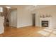Spacious living room with a fireplace, hardwood floors, and natural light at 12561 Gladecrest Dr, Carmel, IN 46033