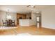 Spacious open floor plan with a kitchen, breakfast nook, and gleaming hardwood floors at 12561 Gladecrest Dr, Carmel, IN 46033