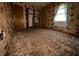 Bedroom features patterned wallpaper, carpeting, closet, and natural light from the window at 129 S Boehning St, Indianapolis, IN 46219