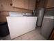 Laundry area equipped with washer, dryer, and utility connections, providing convenience for household chores at 129 S Boehning St, Indianapolis, IN 46219