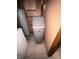 A home water softener stands next to a hot water tank and washing machine at 129 S Boehning St, Indianapolis, IN 46219
