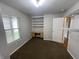 Bedroom featuring a built-in desk, shelving, and a walk-in closet at 1302 Lexington Trl, Greenfield, IN 46140