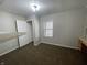 Bedroom featuring a built-in desk, a window, and a closet at 1302 Lexington Trl, Greenfield, IN 46140