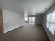 Spacious living room featuring plush carpet and great natural light at 1302 Lexington Trl, Greenfield, IN 46140