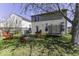 Expansive backyard featuring a trampoline, fire pit, grill, and ample seating at 1328 Osprey Way, Greenwood, IN 46143