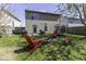 Spacious backyard with a fire pit, seating, grill, and trampoline, perfect for outdoor fun at 1328 Osprey Way, Greenwood, IN 46143