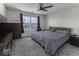 Spacious bedroom with ample natural light, a ceiling fan, and neutral decor at 1328 Osprey Way, Greenwood, IN 46143