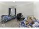 A bedroom featuring two twin beds, a desk, and a bright window view at 1328 Osprey Way, Greenwood, IN 46143