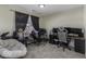 Cozy bedroom featuring a spacious desk, gaming setup, and plush chair at 1328 Osprey Way, Greenwood, IN 46143