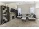Spacious living room featuring a stone fireplace, high ceilings, and a comfortable seating area at 1328 Osprey Way, Greenwood, IN 46143