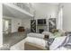 Bright and airy living room with a stone fireplace, soaring ceilings, and stylish furnishings at 1328 Osprey Way, Greenwood, IN 46143