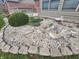 Landscaped backyard featuring rock garden, lawn, and assorted greenery at 1330 Country Creek Cir, Shelbyville, IN 46176