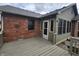 Open backyard deck area attached to a brick house at 1330 Country Creek Cir, Shelbyville, IN 46176