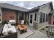 An inviting backyard with an outdoor seating area, a fire table, and greenery at 1330 Country Creek Cir, Shelbyville, IN 46176