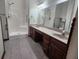 Bathroom with dual sinks and walk-in shower at 1330 Country Creek Cir, Shelbyville, IN 46176