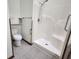 Bathroom featuring a step-in shower with handrails and tile flooring, complemented by modern fixtures at 1330 Country Creek Cir, Shelbyville, IN 46176